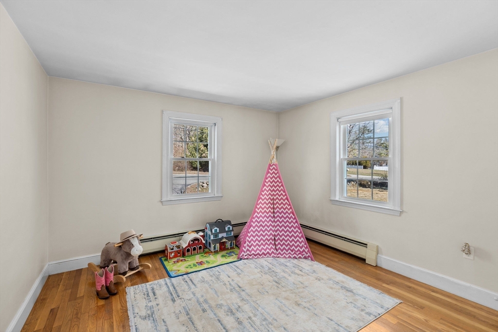 742 Broadway Hanover, MA 02339 - Photo 11 of 42 a view of a room with toys and wooden floor