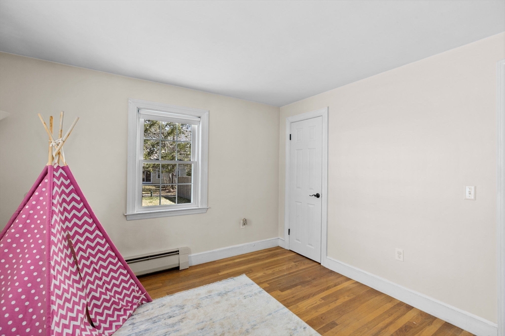 742 Broadway Hanover, MA 02339 - Photo 12 of 42 a view of an empty room with a window