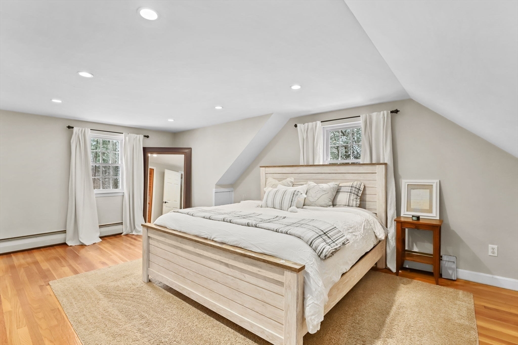 742 Broadway Hanover, MA 02339 - Photo 14 of 42 a bed room with a bed and a night stand