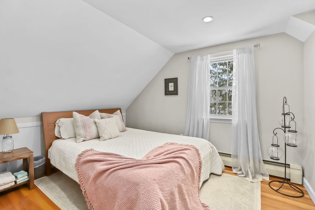 742 Broadway Hanover, MA 02339 - Photo 16 of 42 a bedroom with a bed and wooden floor
