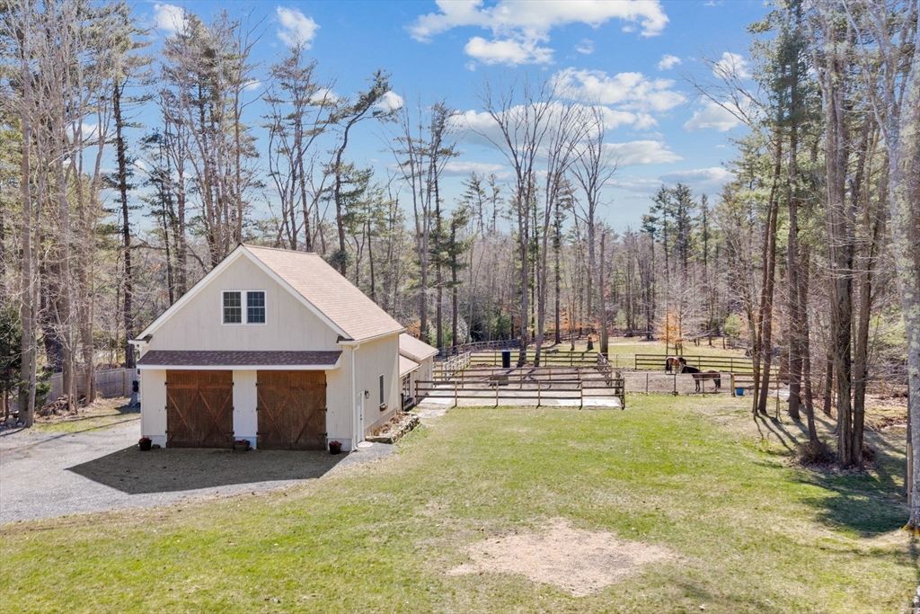 742 Broadway Hanover, MA 02339 - Photo 19 of 42 a front view of residential houses with yard and trees