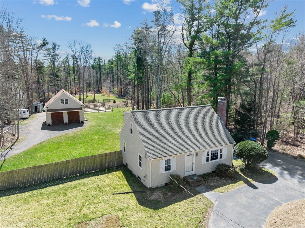 742 Broadway Hanover, MA 02339 - Photo 2 of 42 a aerial view of a house with a yard and large trees