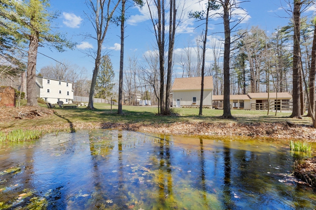 742 Broadway Hanover, MA 02339 - Photo 21 of 42 a swimming pool with outdoor seating and yard