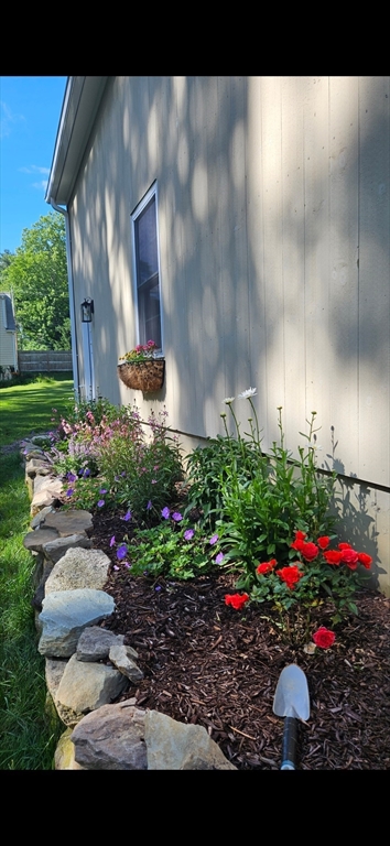 742 Broadway Hanover, MA 02339 - Photo 40 of 42 a view of a house with a yard and garden