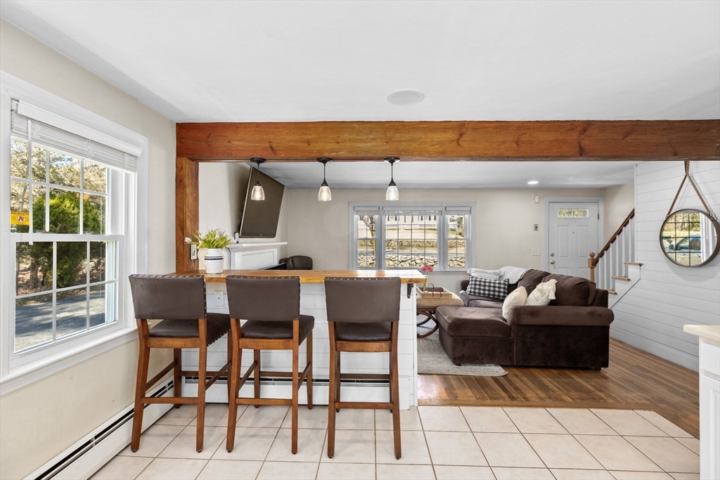 742 Broadway Hanover, MA 02339 - Photo 5 of 42 a dining room with furniture and a large window
