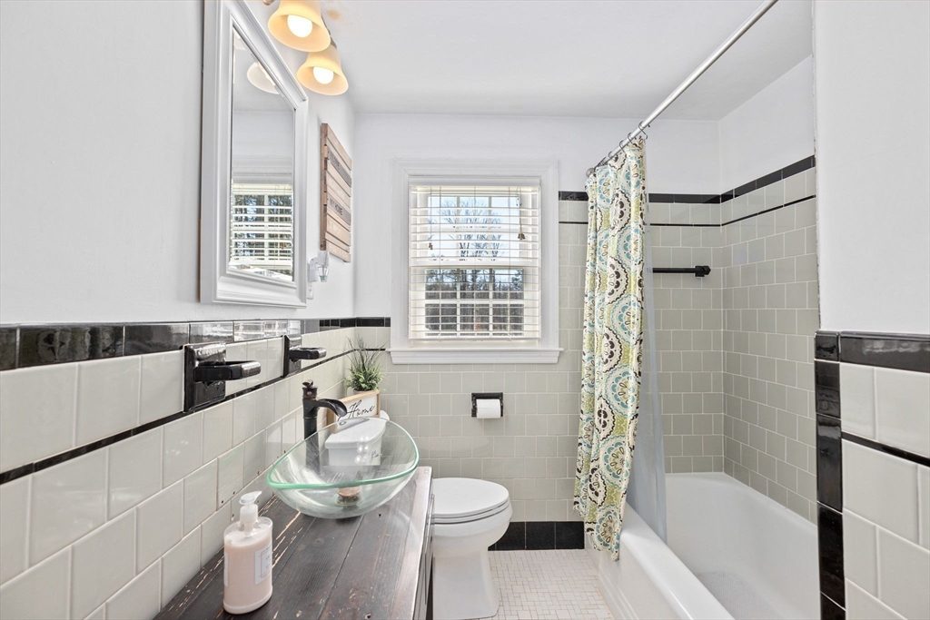 742 Broadway Hanover, MA 02339 - Photo 9 of 42 a bathroom with a bathtub sink and toilet