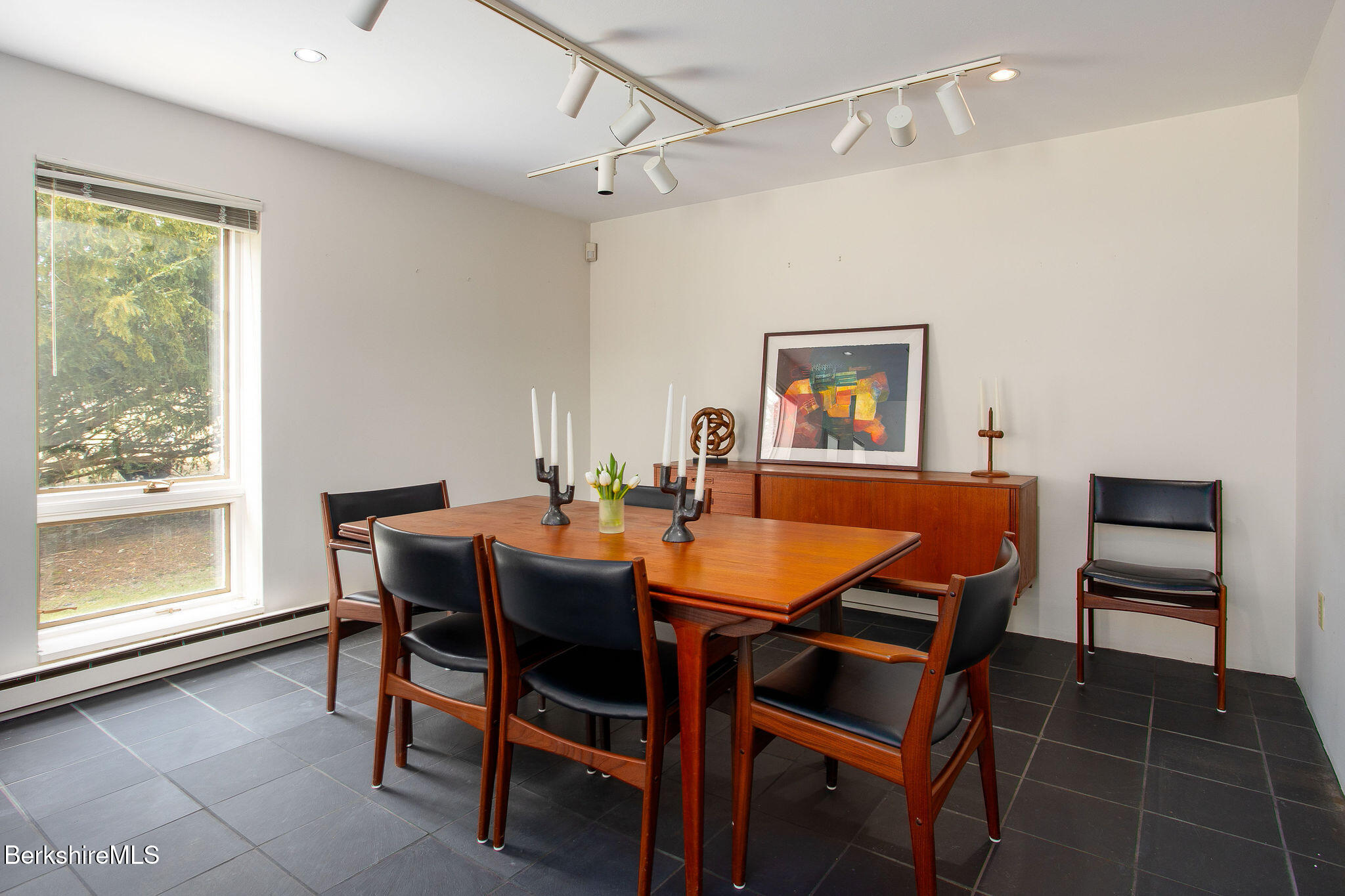 103 Gravesleigh Terrace Pittsfield, MA 01201 - Photo 12 of 46 a dining room with a wooden table and chairs