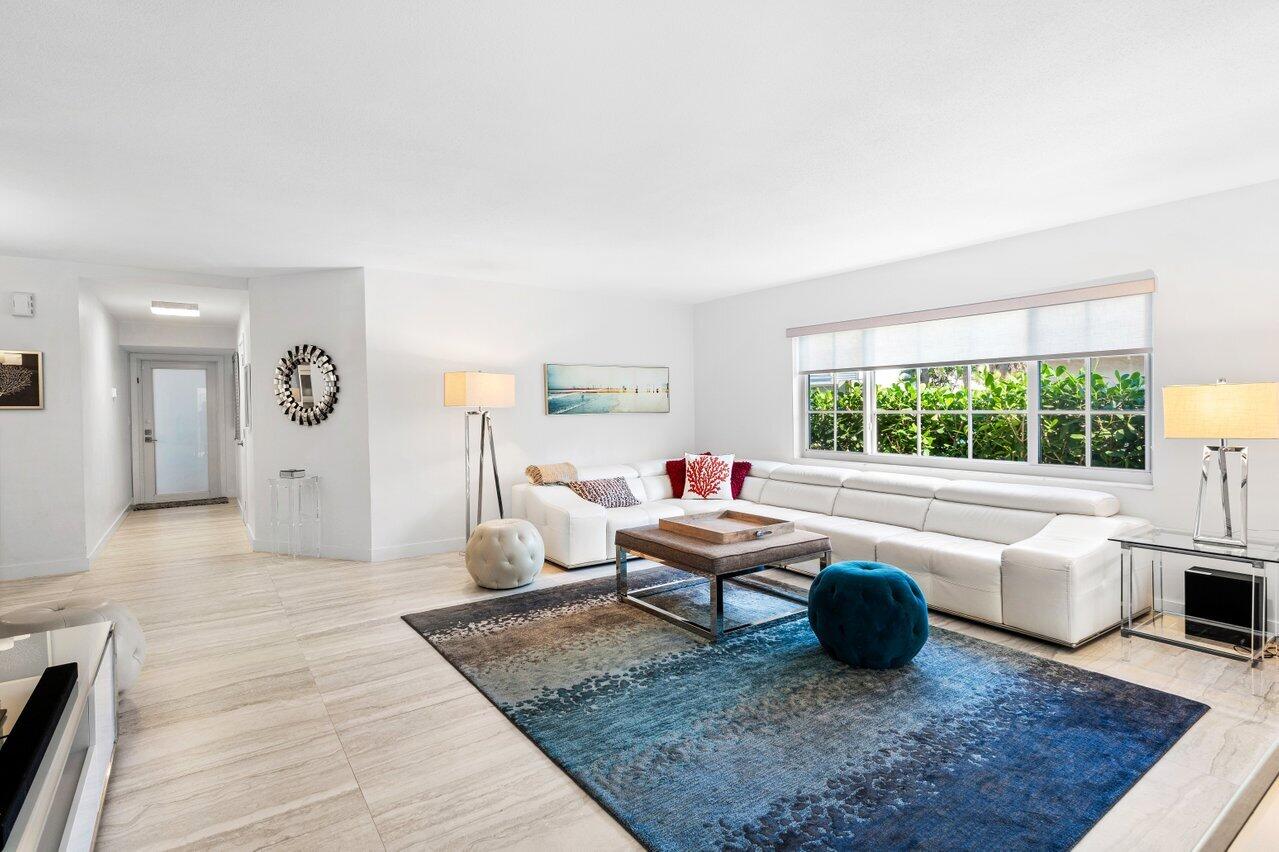 1700 South Ocean Boulevard, Unit 1 Delray Beach, FL 33483 - Photo 13 of 39 a living room with furniture rug and window