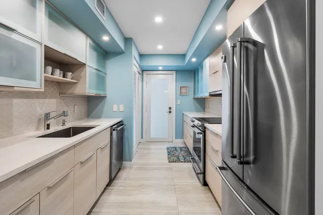 a kitchen with a sink and cabinets