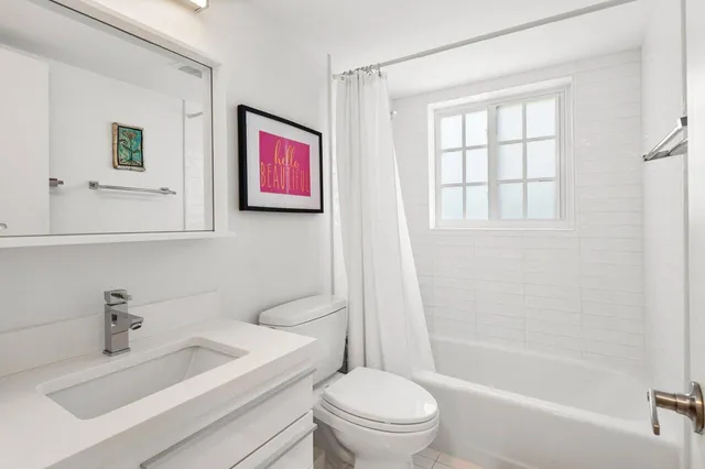 a view of a bedroom with washer and dryer