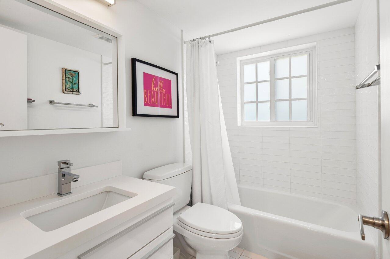 1700 South Ocean Boulevard, Unit 1 Delray Beach, FL 33483 - Photo 27 of 39 a bathroom with a sink toilet and shower