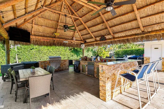 a view of a patio with a table and chairs
