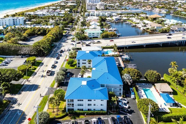 an aerial view of residential houses with outdoor space