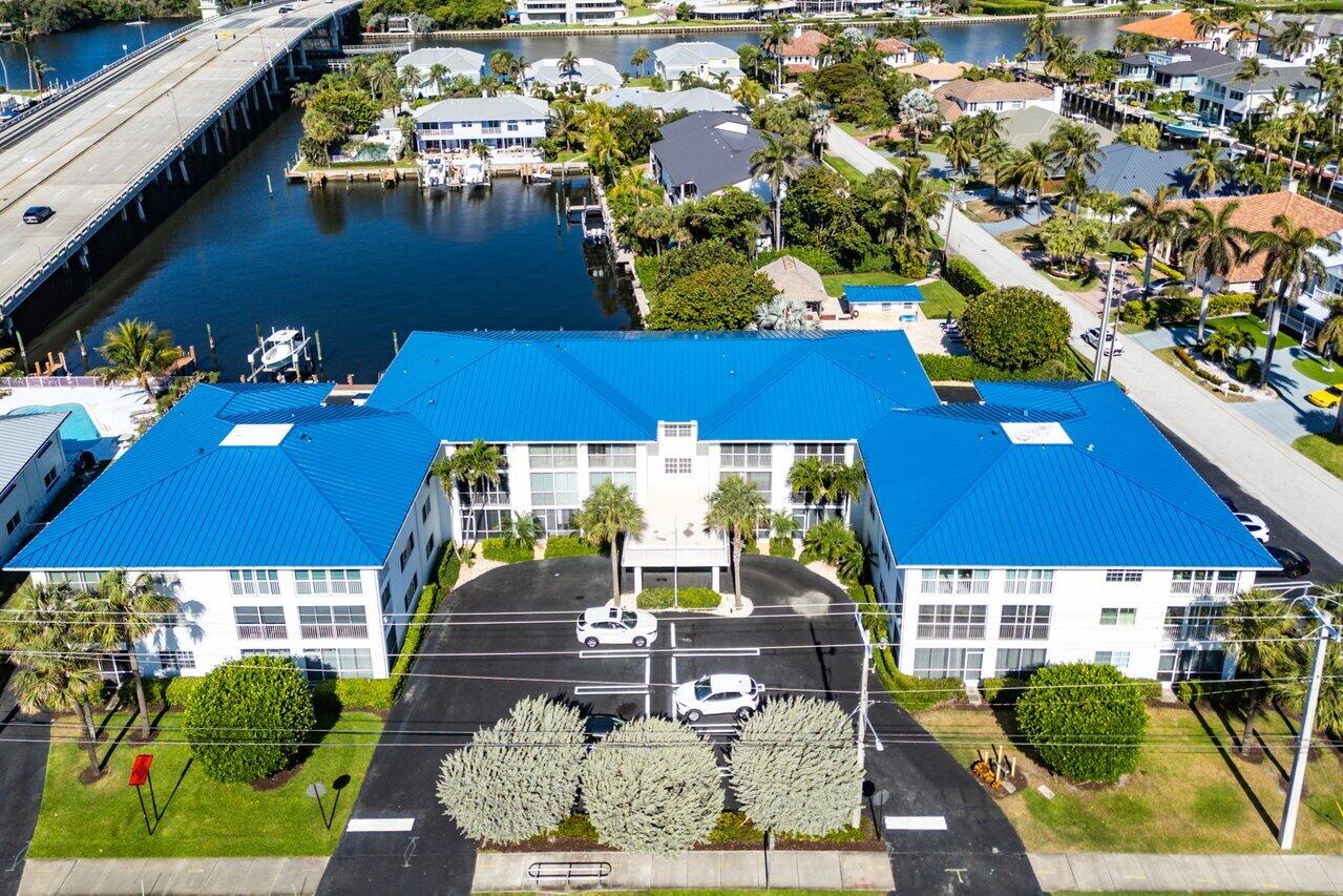 1700 South Ocean Boulevard, Unit 1 Delray Beach, FL 33483 - Photo 9 of 39 an aerial view of multiple houses with yard