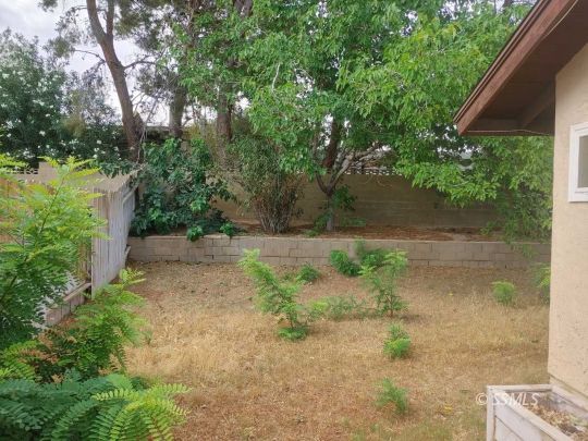 1014 Sherri Street Ridgecrest, CA 93555 - Photo 23 of 23 a backyard of a house with lots of green space and lake view