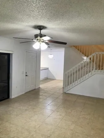 a view of a livingroom with a ceiling fan