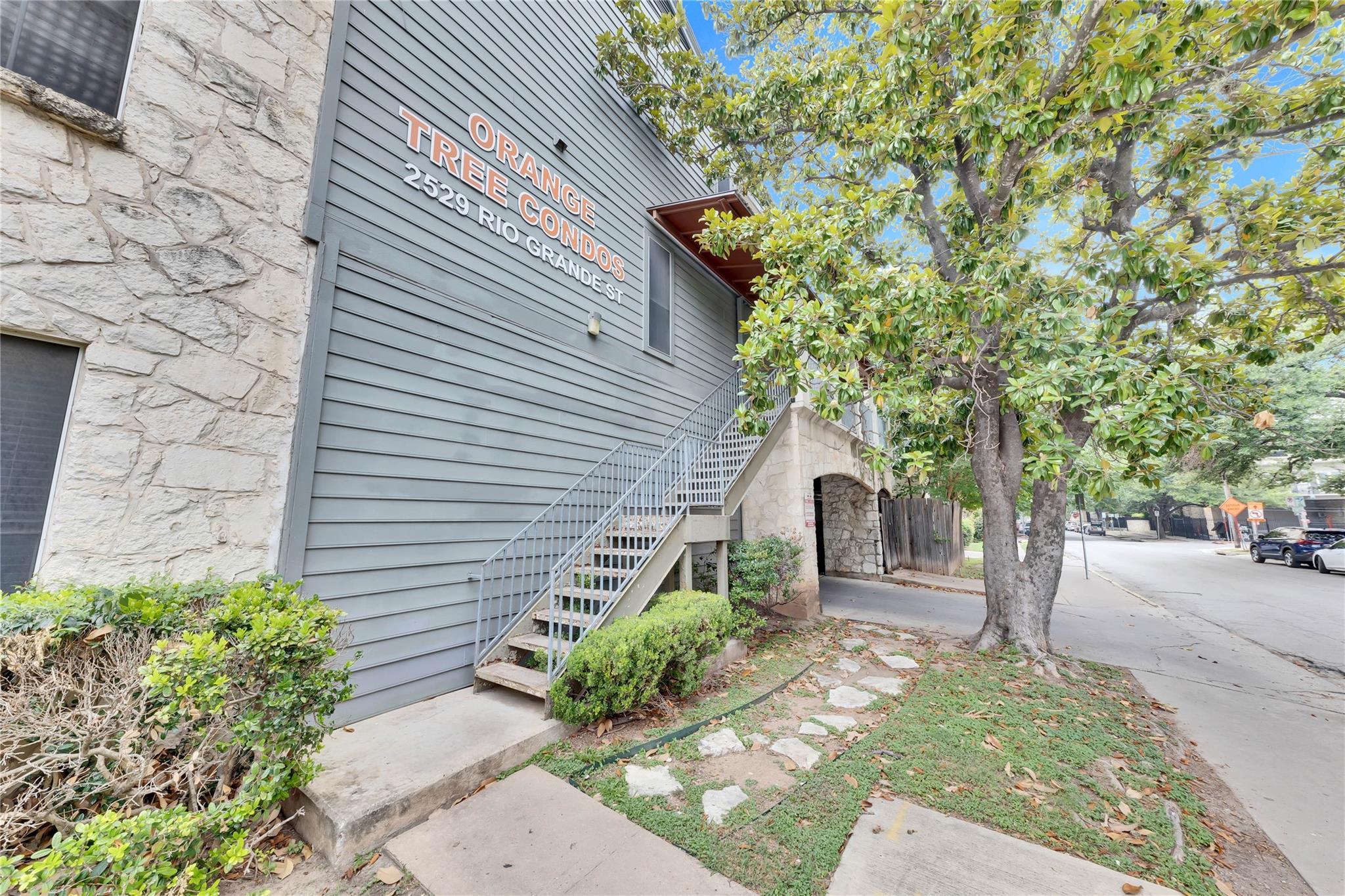 2529 Rio Grande Street, Unit 100 Austin, TX 78705 - Photo 3 of 14 a front view of a house with garden