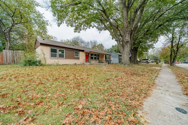 a house with trees in front of it