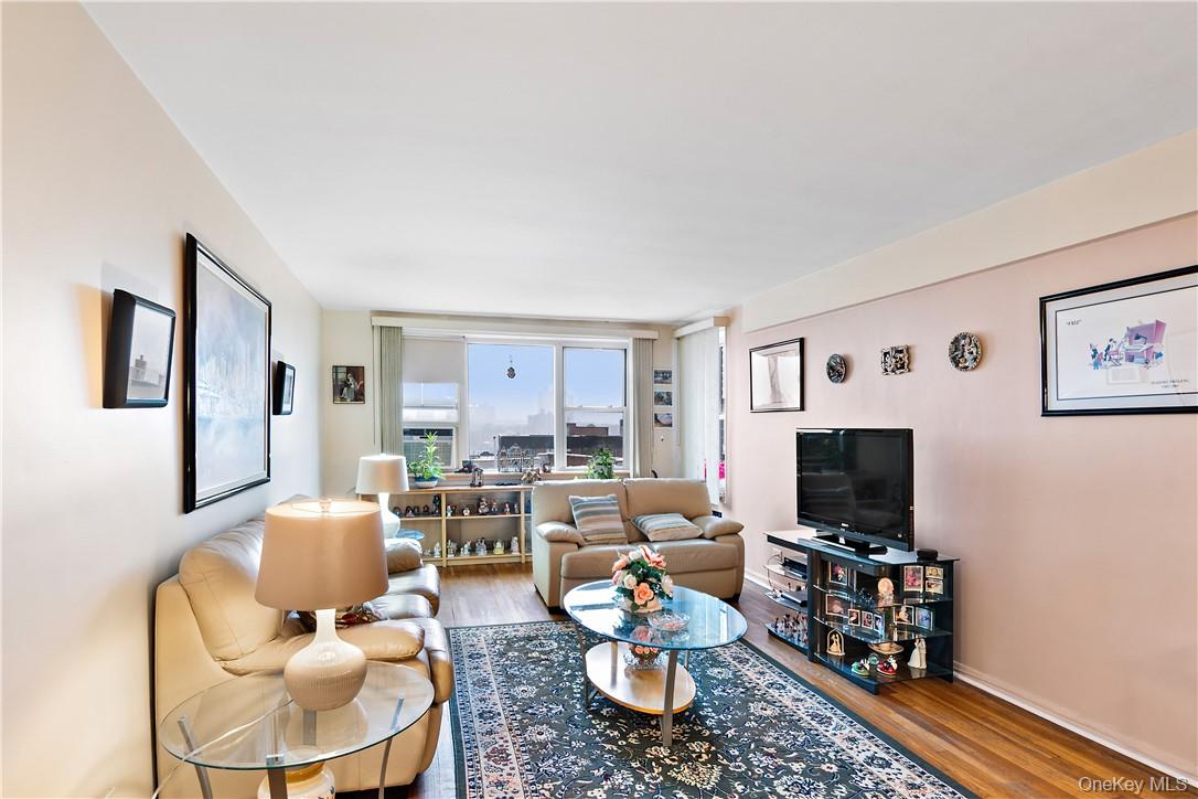 525 West 236th Street, Unit 5B Bronx, NY 10463 - Photo 12 of 18 a living room with furniture and a flat screen tv