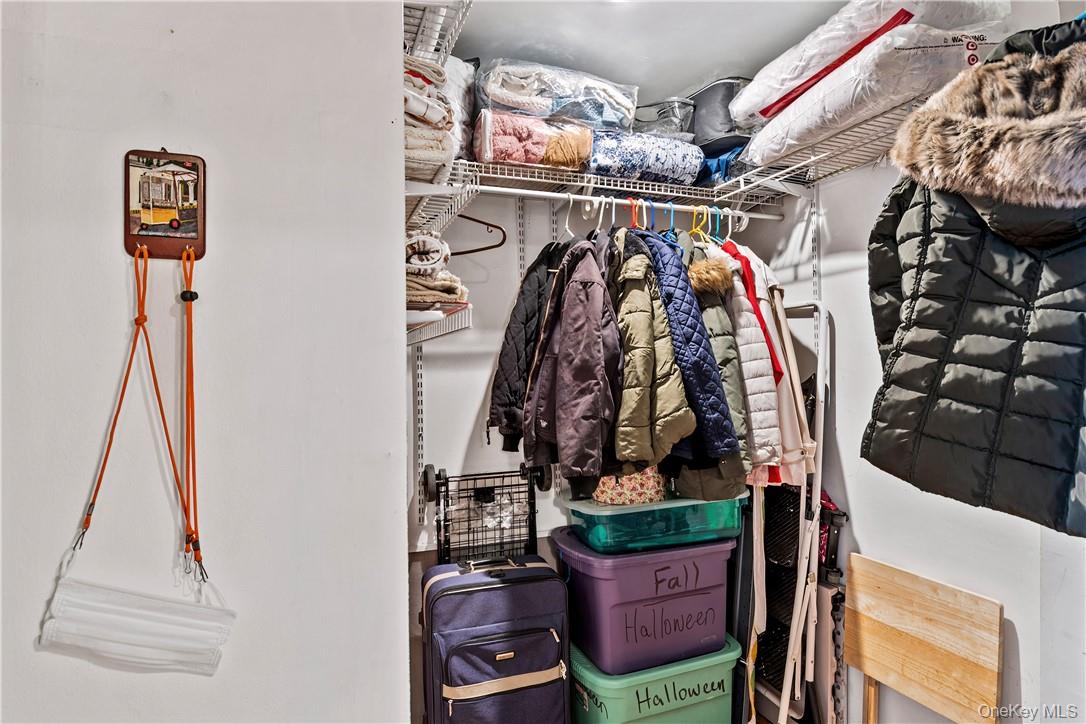 525 West 236th Street, Unit 5B Bronx, NY 10463 - Photo 17 of 18 a view of walk in closet with clothes and shoes