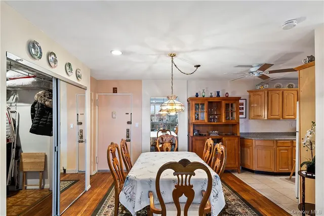 a dining room with furniture and wooden floor