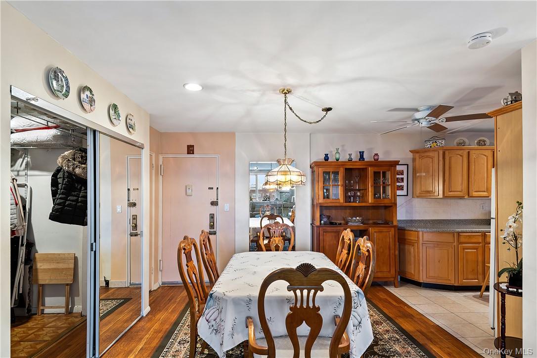 525 West 236th Street, Unit 5B Bronx, NY 10463 - Photo 9 of 18 a dining room with furniture and wooden floor