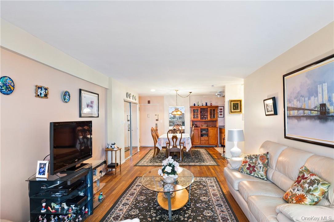 525 West 236th Street, Unit 5B Bronx, NY 10463 - Photo 10 of 18 a living room with furniture and a flat screen tv