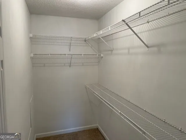 a view of a room with racks on the wall