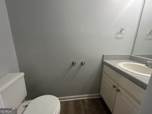 a bathroom with a sink and toilet