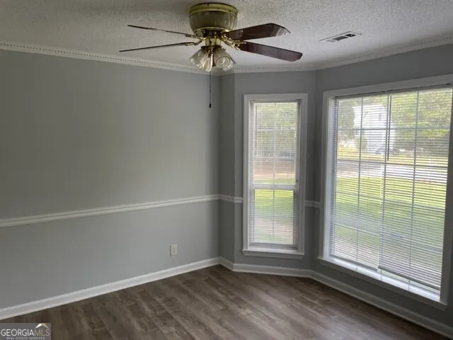 a view of room with window and hardwood
