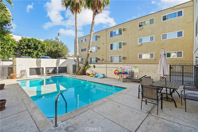 a view of a patio with a table and chairs