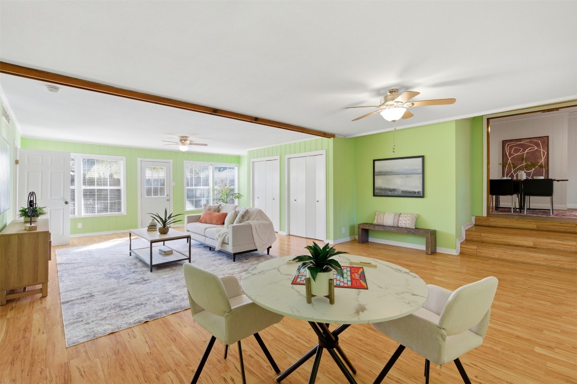 1506 Grace Street Taylor, TX 76574 - Photo 14 of 21 Family room with a ceiling fan, light wood-style flooring, and ornamental molding