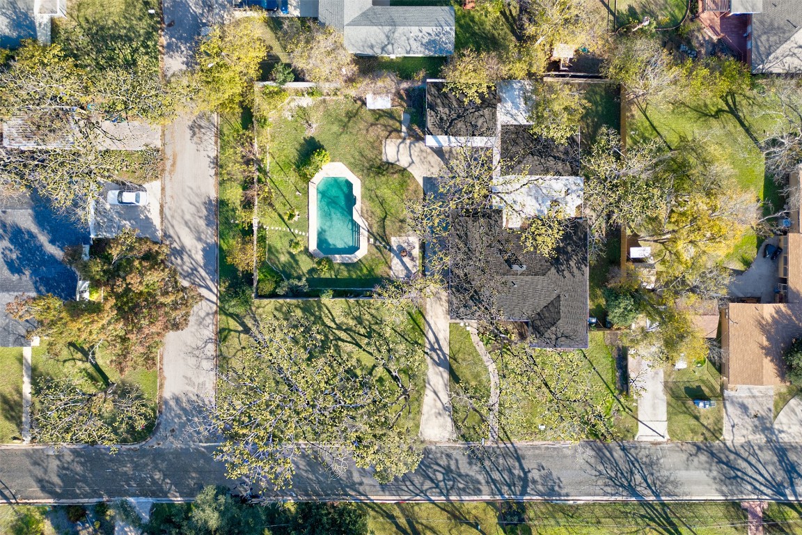 1506 Grace Street Taylor, TX 76574 - Photo 21 of 21 Aerial view of property and surrounding area featuring a pool and spacious yard with mature trees
