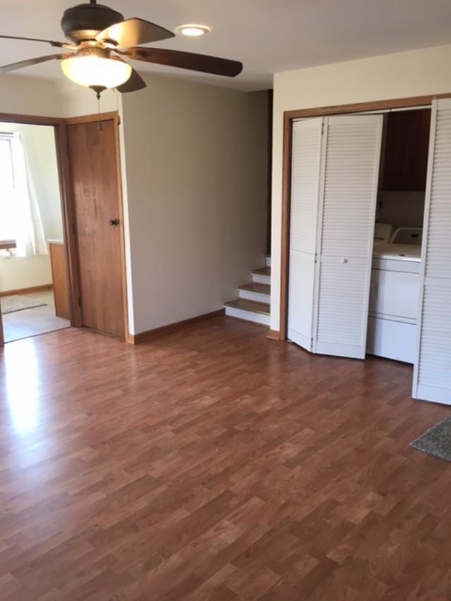 13078 Church Road Yorkville, IL 60560 - Photo 19 of 22 an empty room with wooden floor and windows