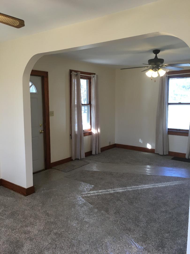 13078 Church Road Yorkville, IL 60560 - Photo 3 of 22 a view of a livingroom with a ceiling fan and window