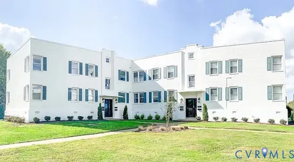 a view of a building with a yard