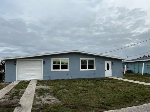 a house view with a backyard space