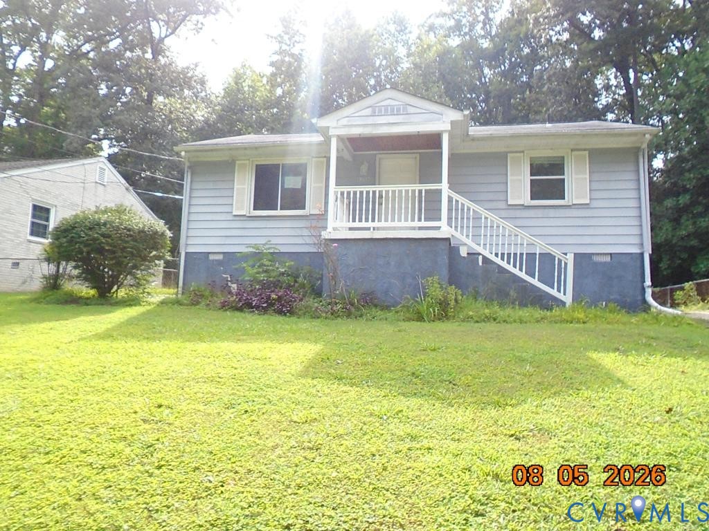 6256 Hickory Road Quinton, VA 23141 - Photo 1 of 16 Light blue siding exterior with white window shutt