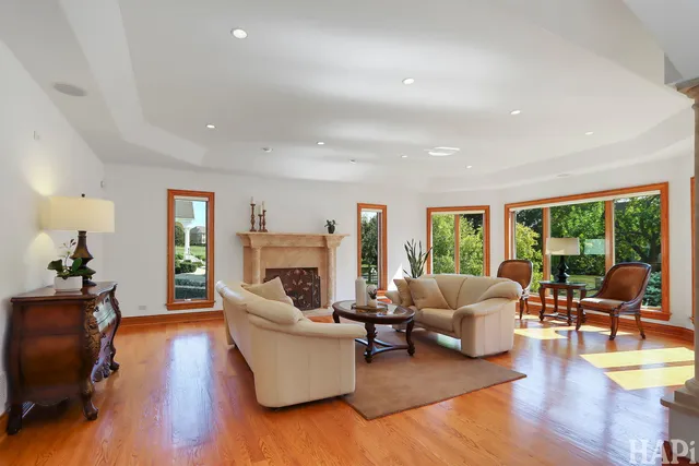 a living room with furniture fireplace and flat screen tv