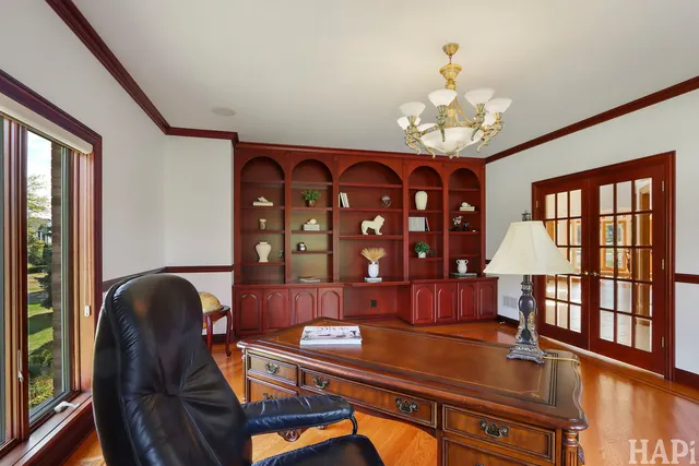 a kitchen with stainless steel appliances granite countertop a sink a stove and a wooden cabinets