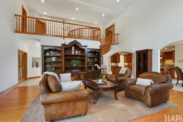 a spacious bathroom with a tub a sink and a large mirror