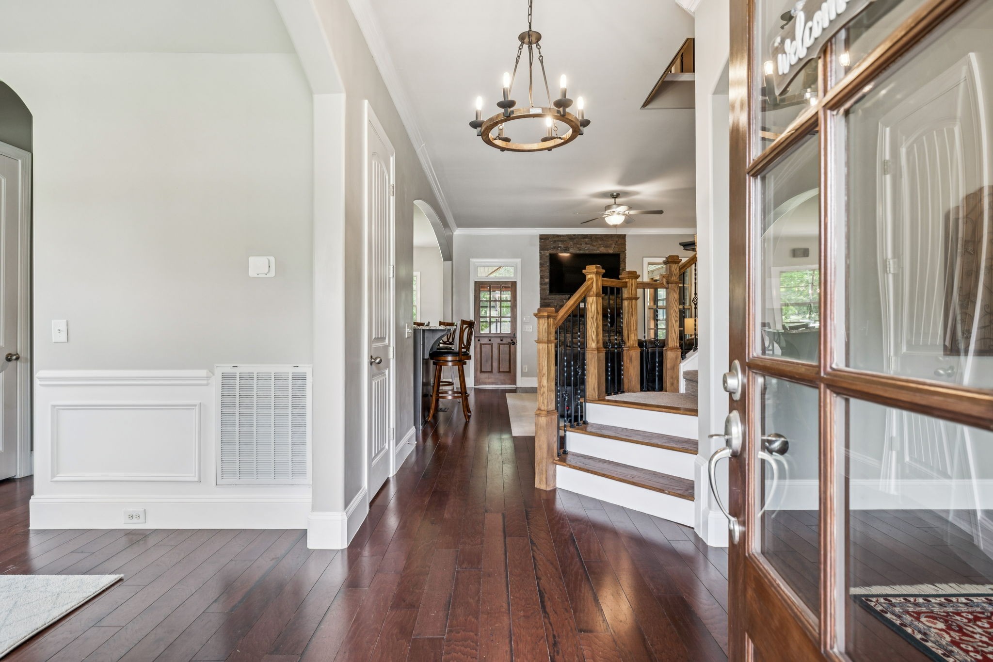 1501 Registry Row Arrington, TN 37014 - Photo 5 of 77 a view of a hallway with wooden floor and staircase