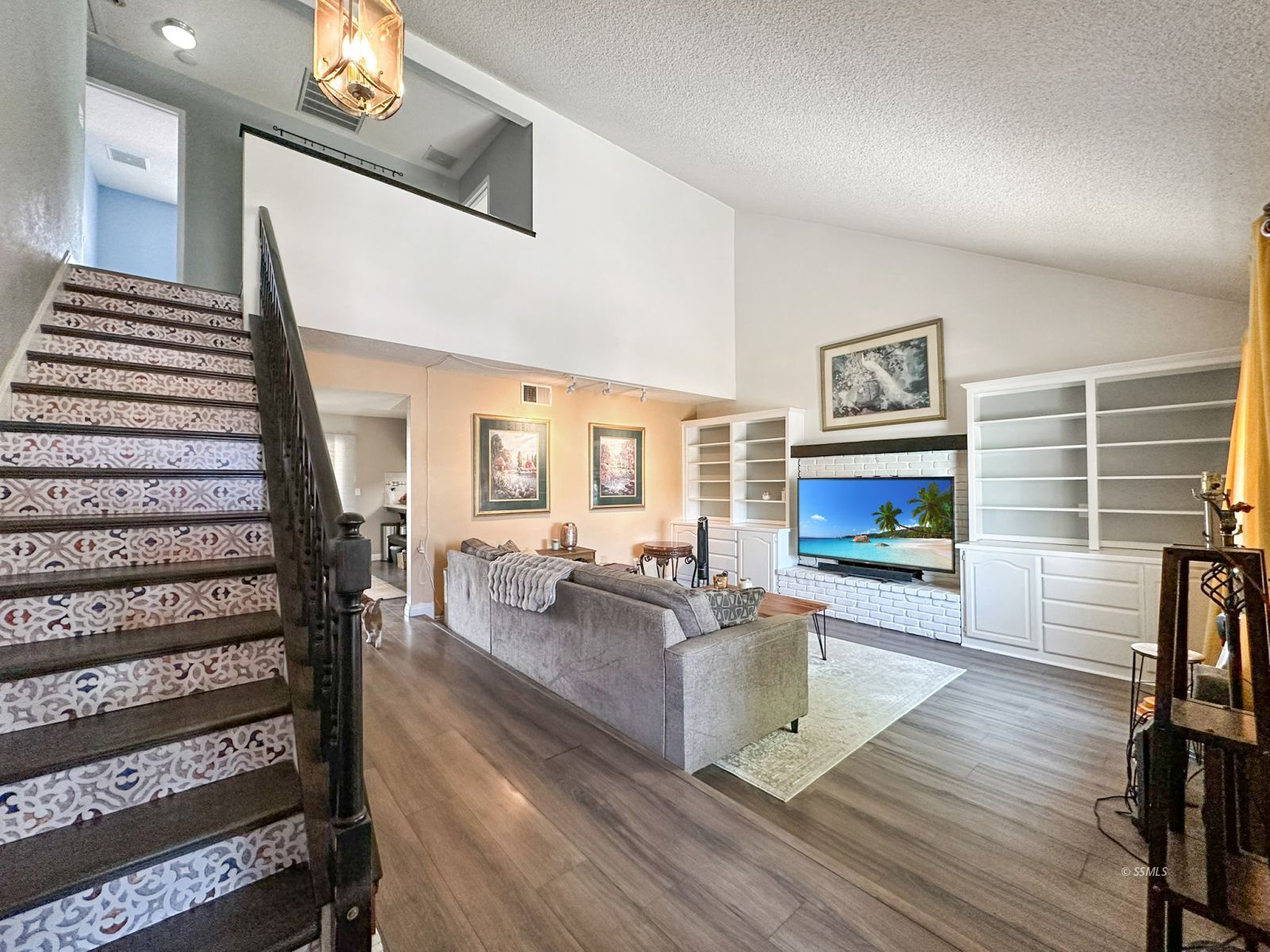724 West Dolphin Avenue Ridgecrest, CA 93555 - Photo 7 of 50 a living room with furniture and a fireplace