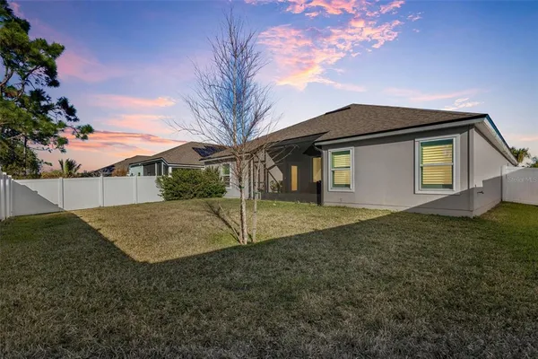 a house view with a backyard space