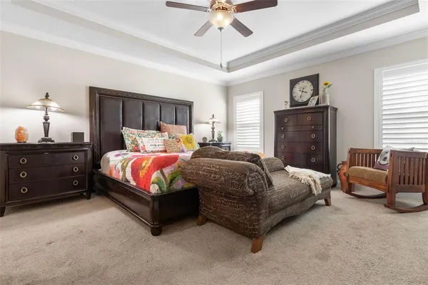 a bedroom with a bed and a chair
