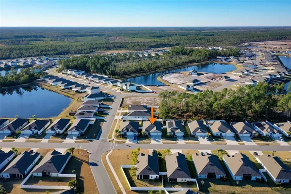 an aerial view of a house patio swimming pool and outdoor seating