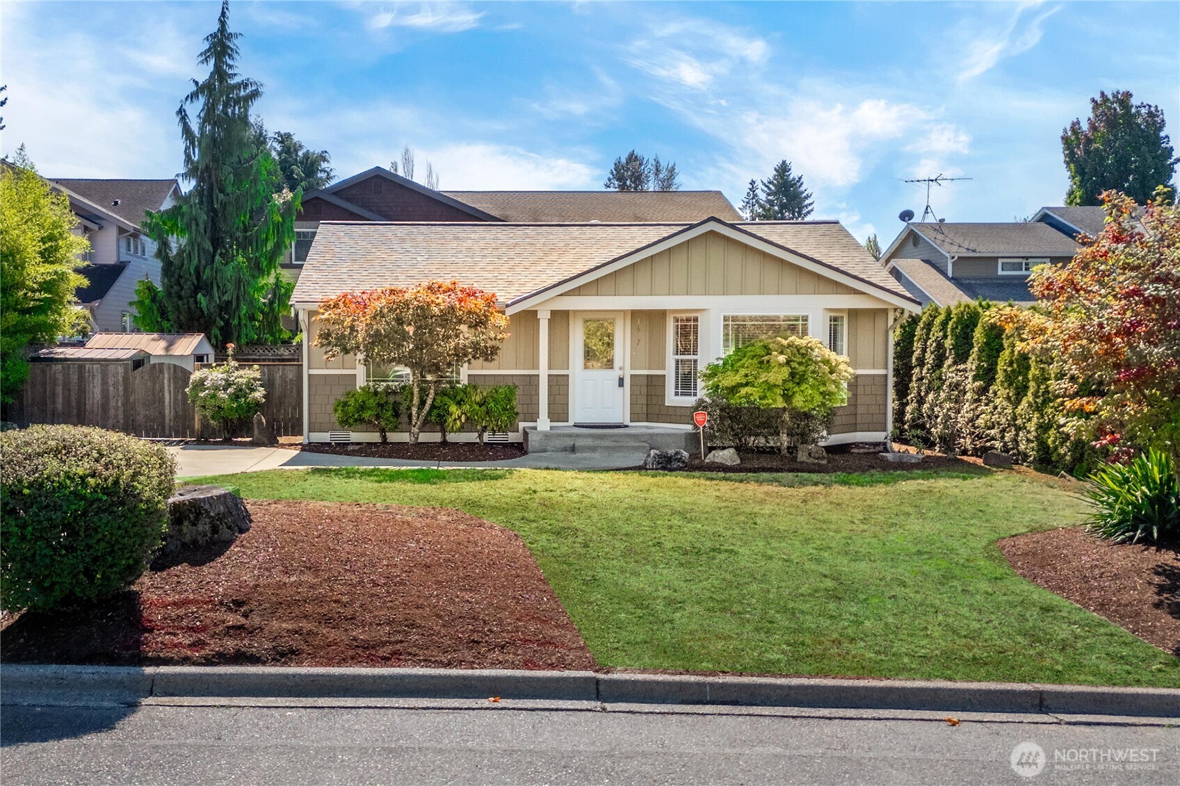 1617 Northeast 28th Street Renton, WA 98056 - Photo 3 of 33 a front view of a house with a yard