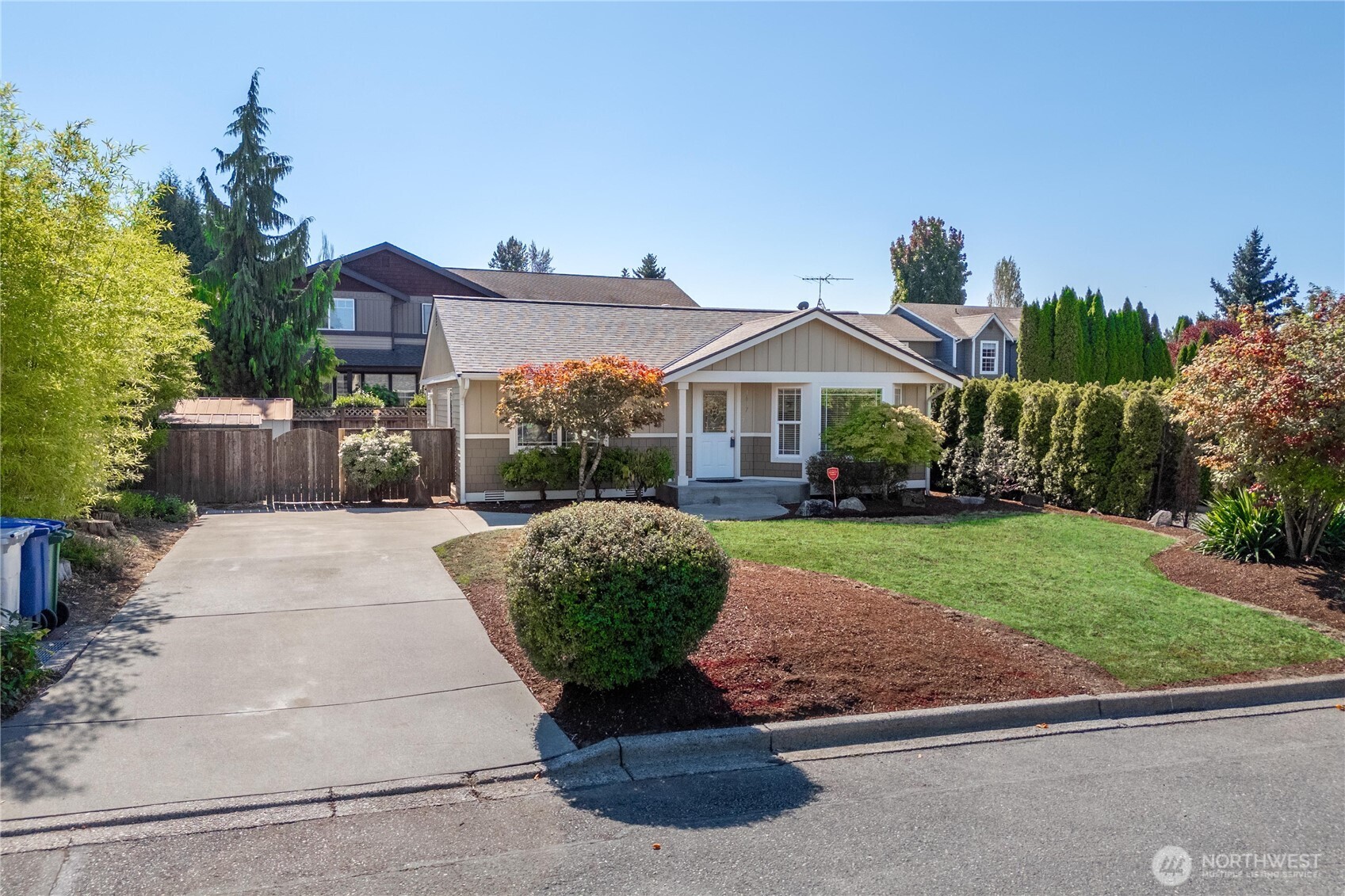 1617 Northeast 28th Street Renton, WA 98056 - Photo 5 of 33 a front view of a house with garden