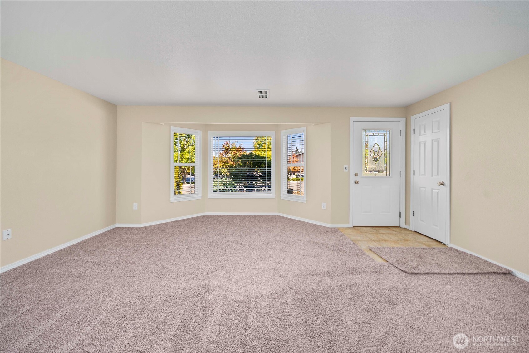 1617 Northeast 28th Street Renton, WA 98056 - Photo 8 of 33 an empty room with windows and closet