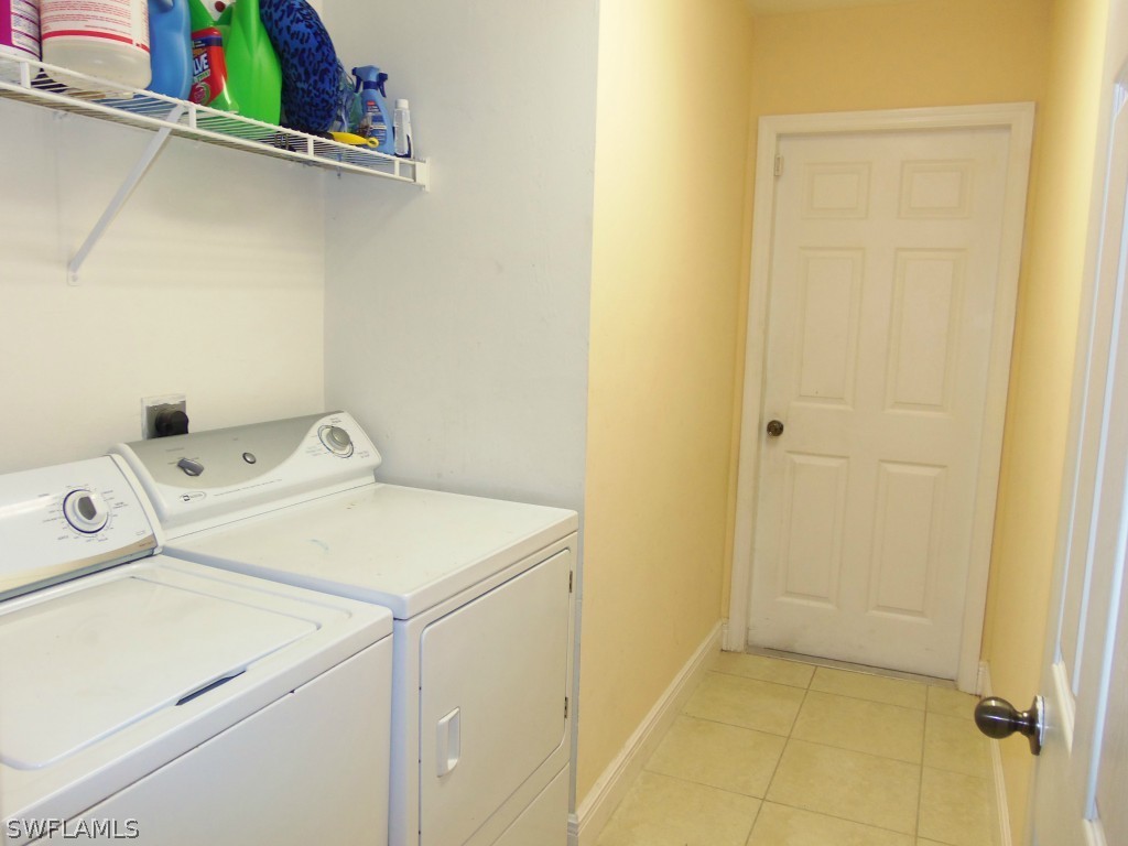 462 Rajah Street Lehigh Acres, FL 33974 - Photo 16 of 17 a utility room with dryer and washer